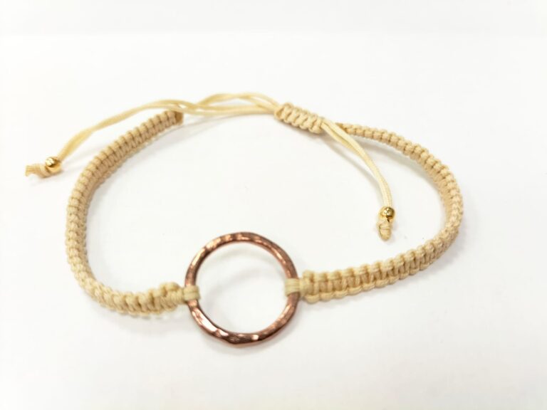 Bracelet woven from nylon thread with a karma charm finished in 14K gold plating.